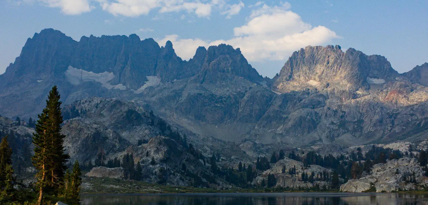 Jagged mountain peaks above an alpine lake